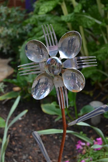 Garden art created from old kitchen utensils