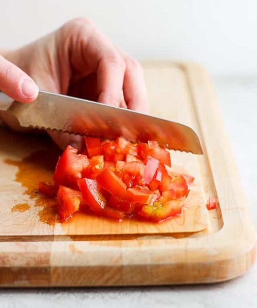 Chop the tomatoes into small pieces