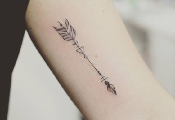 a small arrow tattoo