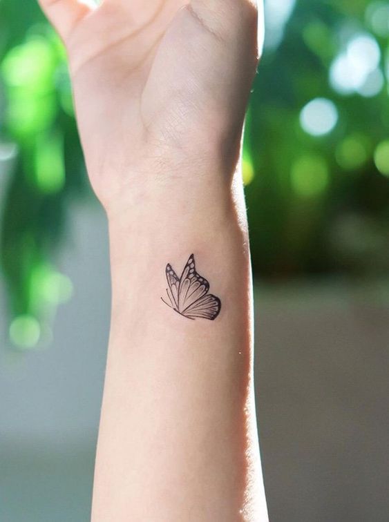 a small butterfly tattoo