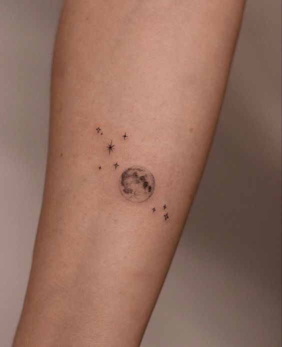 a small moon tattoo
