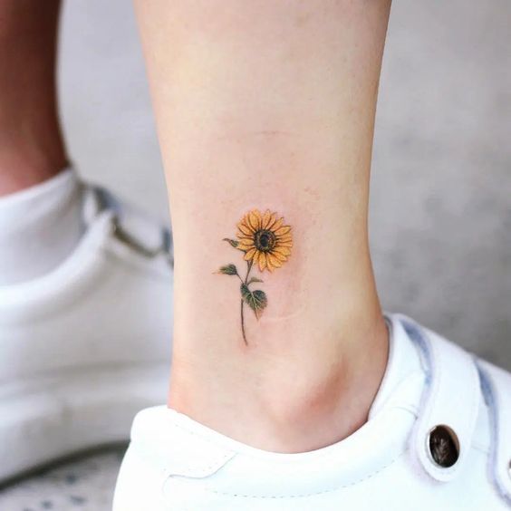 a small sunflower tattoo