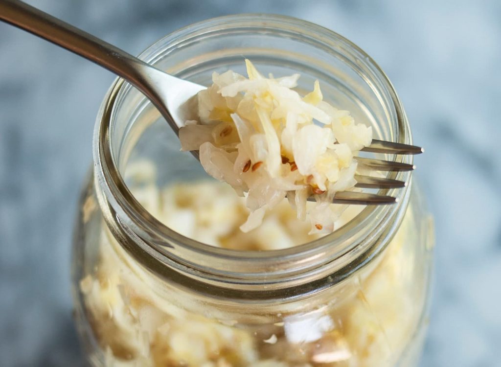 packing-sauerkraut-in-mason-jar